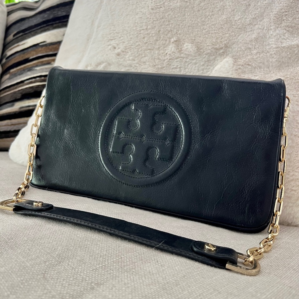 Excellent condition Tory Burch flip bag. Black leather with gold chain.